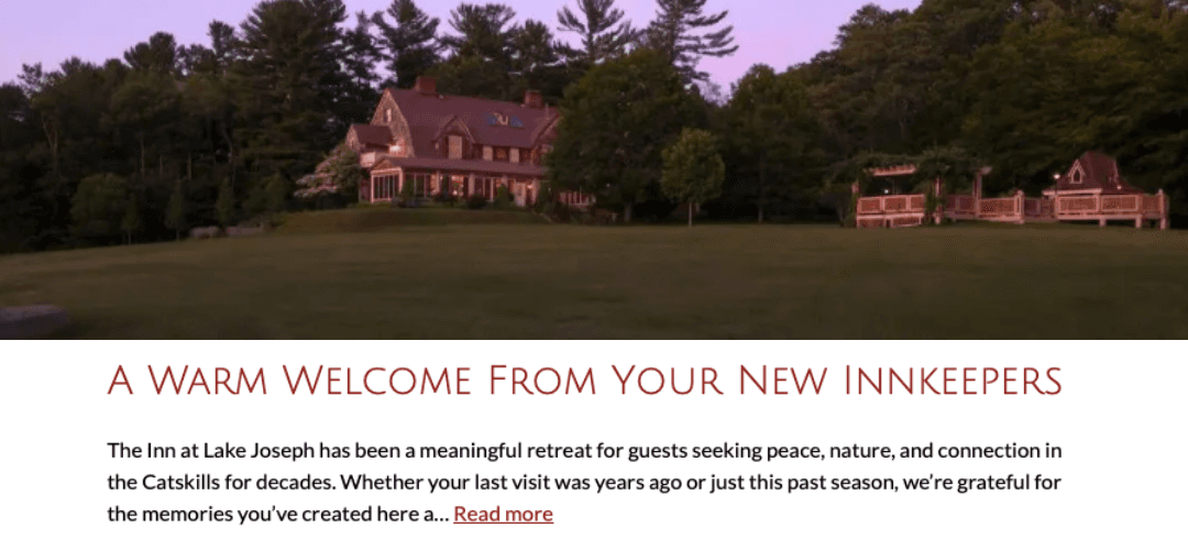 A serene view of The Inn at Lake Joseph surrounded by lush trees during sunset.