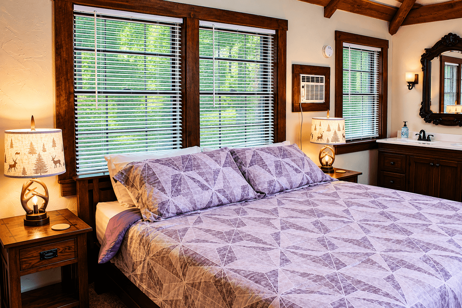 A cozy bedroom featuring a large bed with a purple patterned quilt, wooden furniture, and natural light from windows.